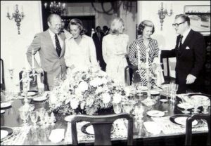 FINE DINING: Vice President Nelson A. Rockefeller and President Ford gather around the dining room table with their wives, along with Susan Ford, at the Vice President's Residence in Washington, D.C. in 1975. Ford ascended to the Presidency after Nixon's resignation, thus he never lived at the home. His Vice President, Nelson Rockefeller, chose to stay at their grand mansion on Foxhall Road instead. Vice President Walter F. Mondale and his family were the first full-time VP residents of the home, beginning on January 20, 1977. Photo Credit: http://georgewbush-whitehouse.archives.gov/history/photoessays/vpresidence/06-js.html. Text Credit: Charles Denyer.