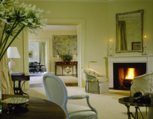 FRANK & LYNNE. Famed Designer Frank Randolph of Georgetown and Mrs. Cheney worked closely together while decorating the residence, which included tones of celadon highlighting the living room that contained personal pieces collected over the years by the Cheneys. Mrs. Cheney reached out to Randolph because she admired his open, elegant, and comfortable style of design. Number One Observatory Circle, the official home and residence of the Vice President of the United States. (Photographer: Durston Saylor for Architectural Digest, November 2001). Text credit: Charles Denyer.