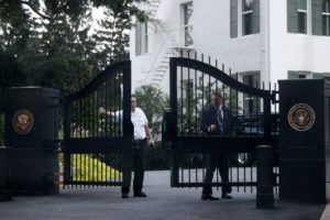 SERIOUS SECURITY: A member of the Secret Service’s Uniformed Division closes a gate to the vice president’s residence at the US Naval Observatory. Number One Observatory Circle, the official home and residence of the Vice President of the United States, built in 1893 at a cost of $20,000. (Credit: (AP Photo/Charles Dharapak, ID: 742076799073). Text credit: Charles Denyer.