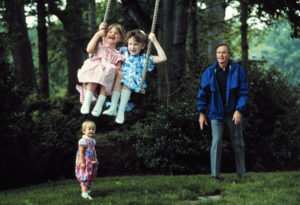 Swing Time: Vice President Bush with 3 of his grandchildren including Barbara and Jenna Bush on the lawn at the Naval Observatory Vice President House in Washington DC. Photographer: David Valdez. Text Credit: Charles Denyer.